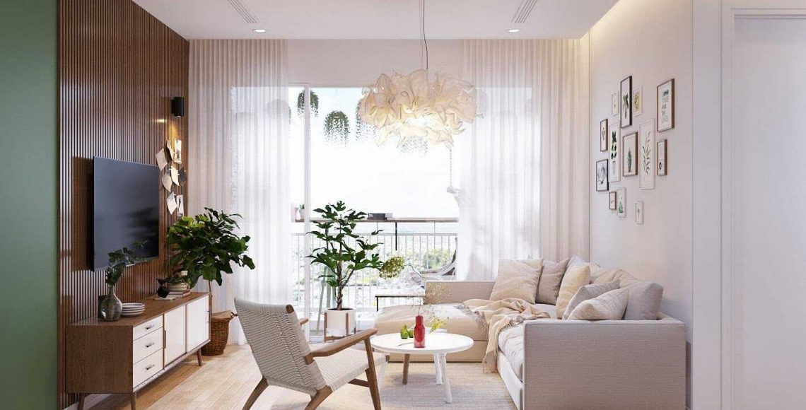 Phòng khách đơn giản với bộ sofa màu kem áp tường rất gọn gàng, kết hợp với một chiếc ghế nhỏ cùng bàn trà hình tròn trông đẹp mắt
